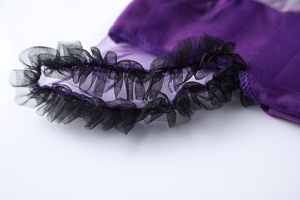 Close-up of ruffled detail on a girls purple bat costume with sheer fabric accents