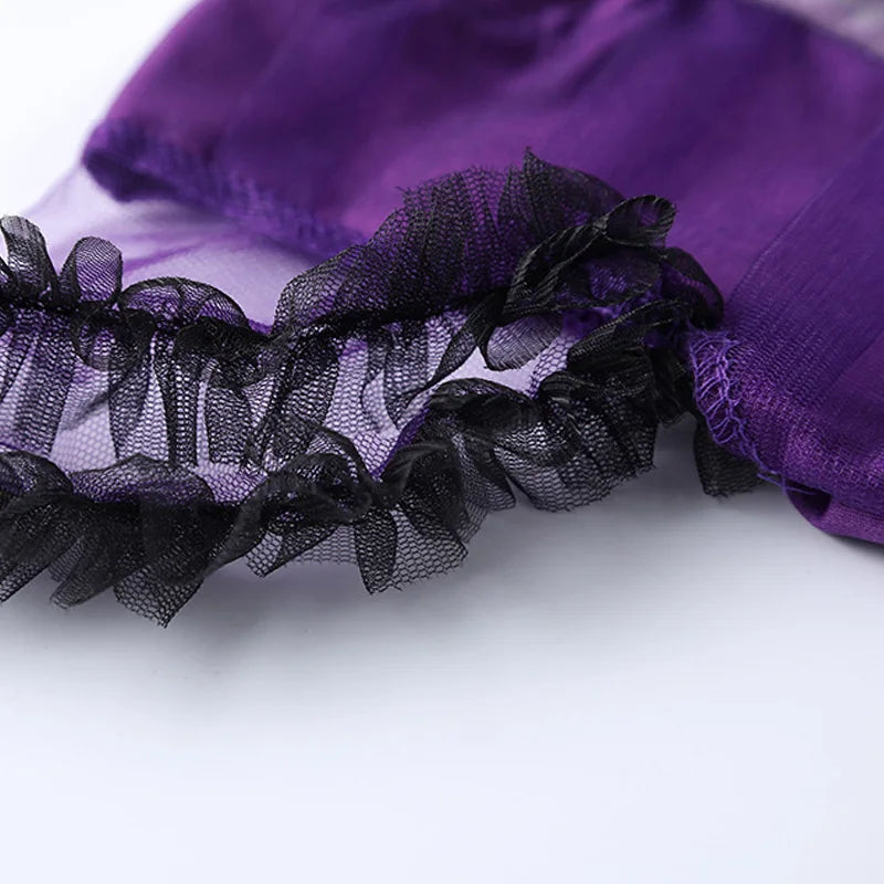 Girls purple bat costume featuring delicate black ruffle detailing and sheer fabric accents