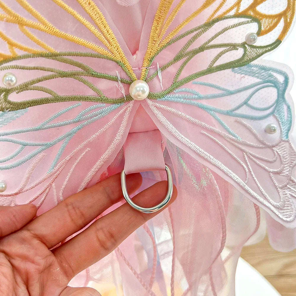 Close-up of a gorgeous puppy butterfly skirt featuring colorful embroidery and pearly embellishments