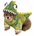 Adorable dog wearing a green pet dinosaur outfit with a hood and spikes for fun dress-up occasions
