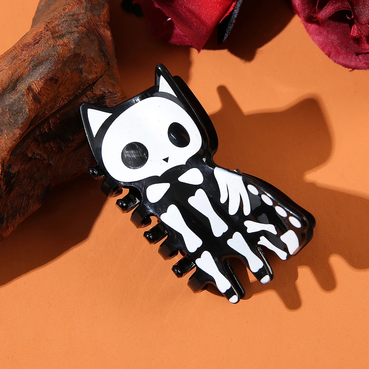 Halloween acrylic skull hair accessory featuring skeleton design and cute cat shape