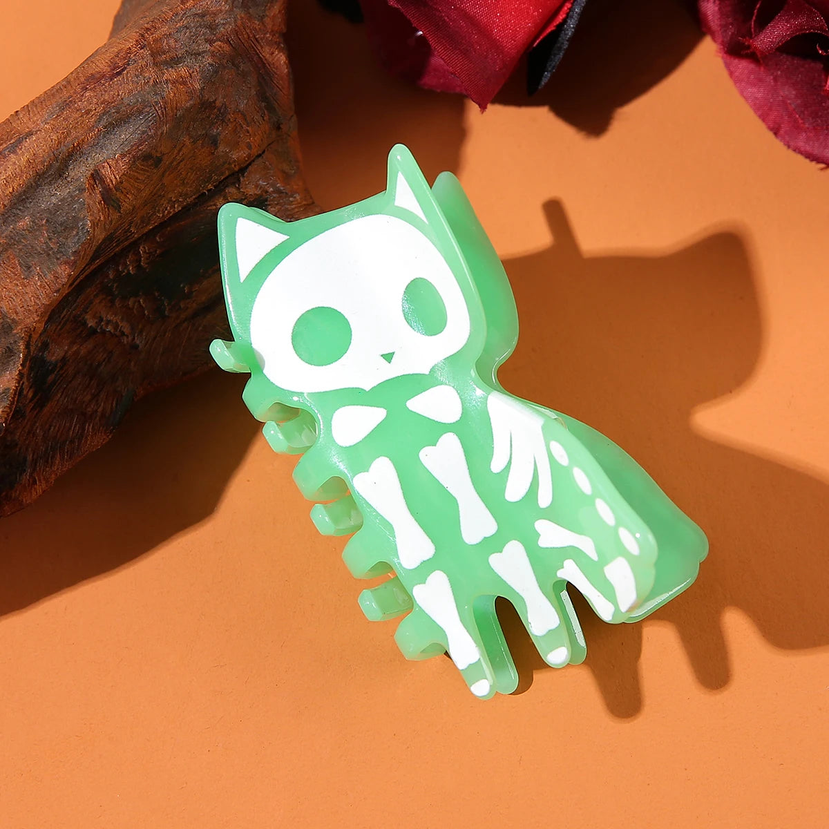 Cute green skeleton cat hair accessory perfect for Halloween celebrations.