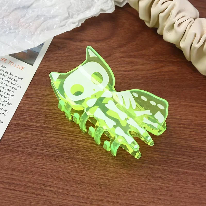 Halloween acrylic skull hair accessory in neon green with a fun cat design for spooky hairstyles