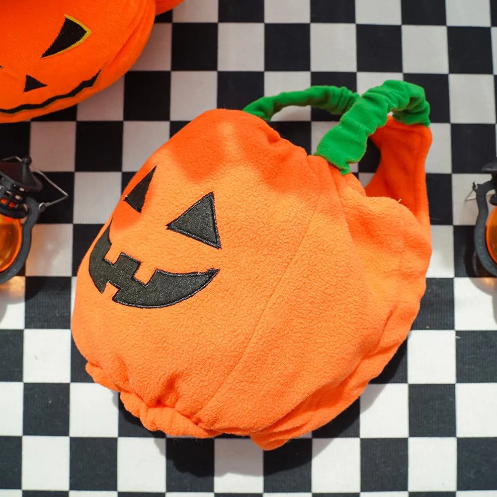 Orange pumpkin Halloween Christmas dog costume with black facial features for festive pet fun