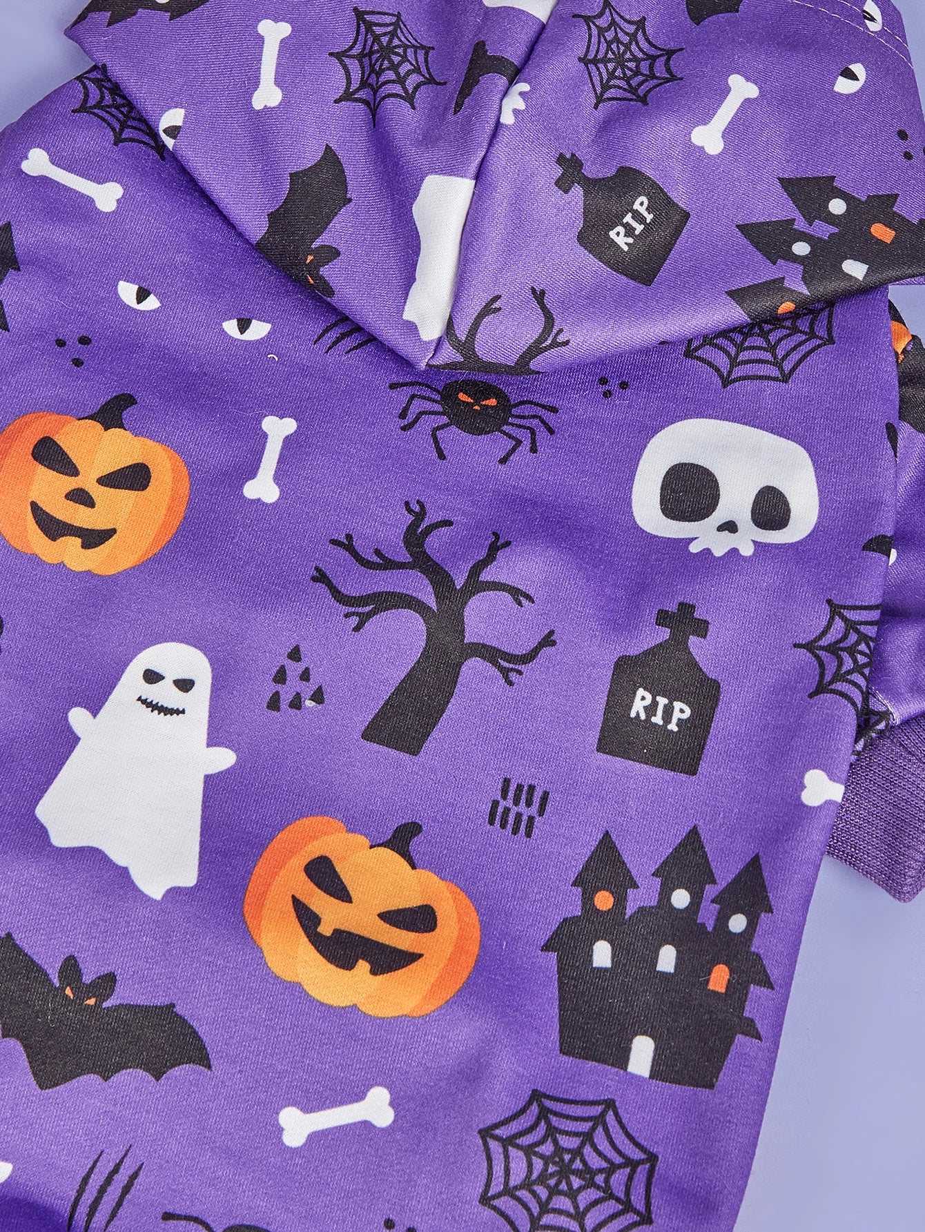 Halloween dog costumes for small dogs featuring spooky prints of pumpkins, ghosts, and bats