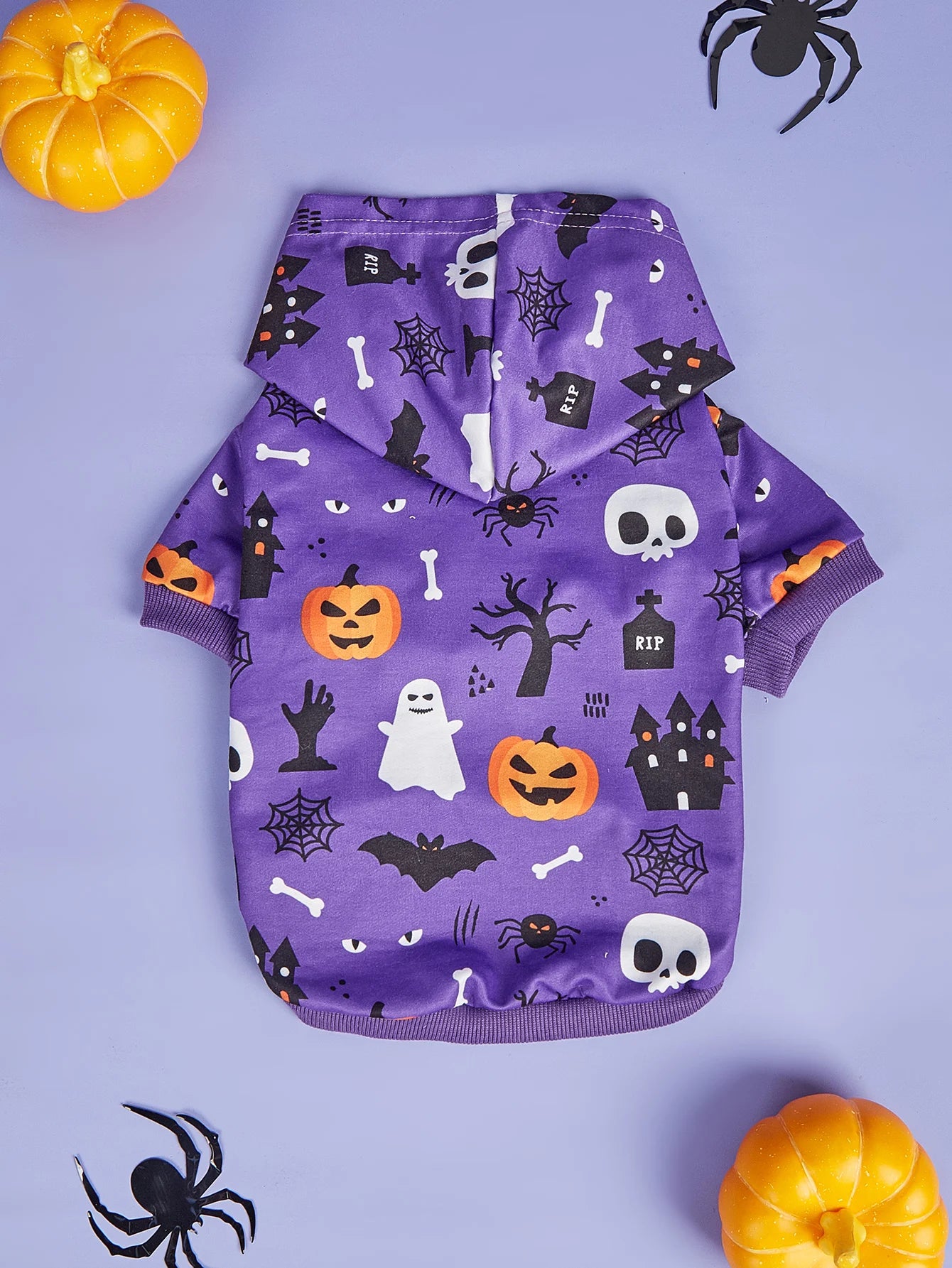 Purple Halloween dog costume for small dogs featuring spooky patterns and a hood