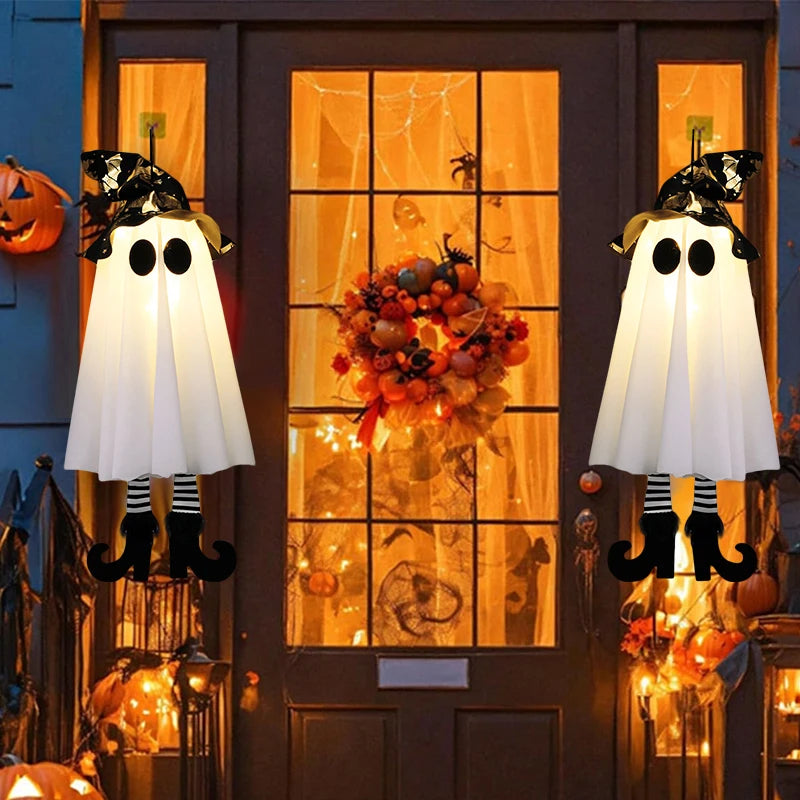 Halloween LED witch ghost decorations illuminating a festive porch with pumpkins and wreath