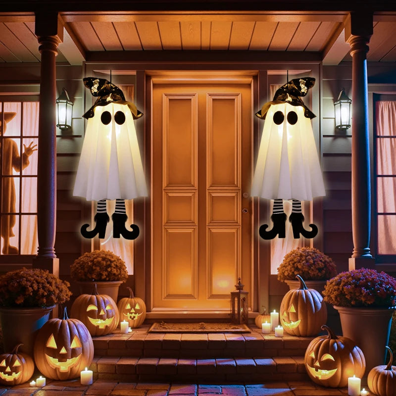 Halloween LED witch ghost decorations hanging on porch with pumpkins and candles for a festive look