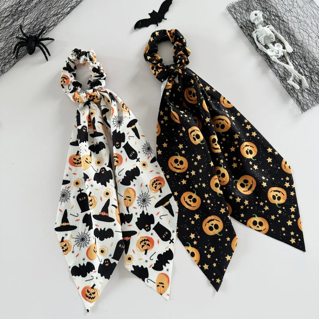 Halloween scrunchies set featuring spooky designs with bats and pumpkins for festive hair accessories
