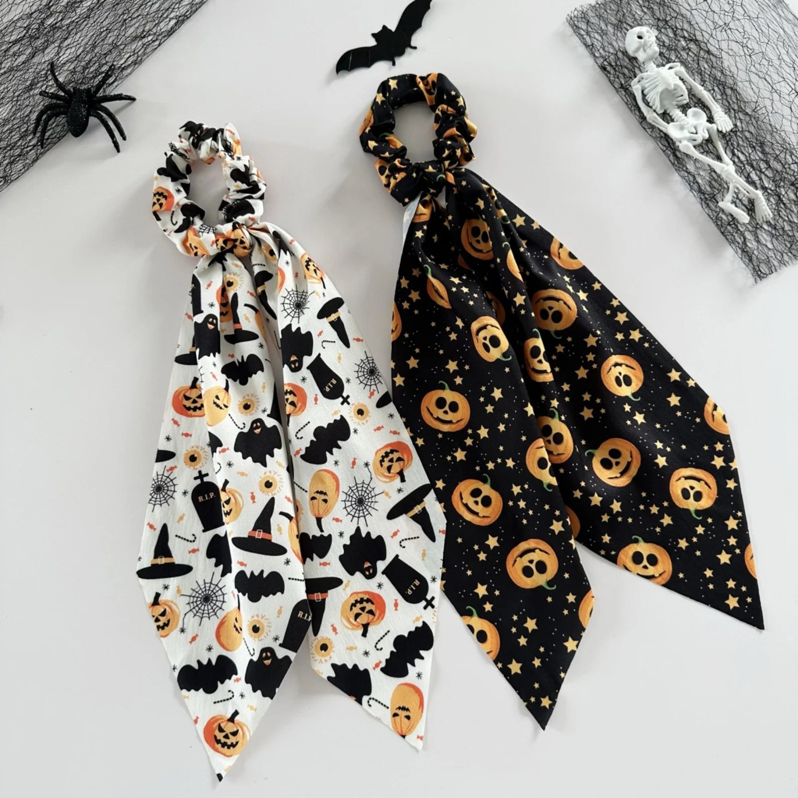 Halloween scrunchies set featuring spooky designs with bats and pumpkins for festive hair accessories
