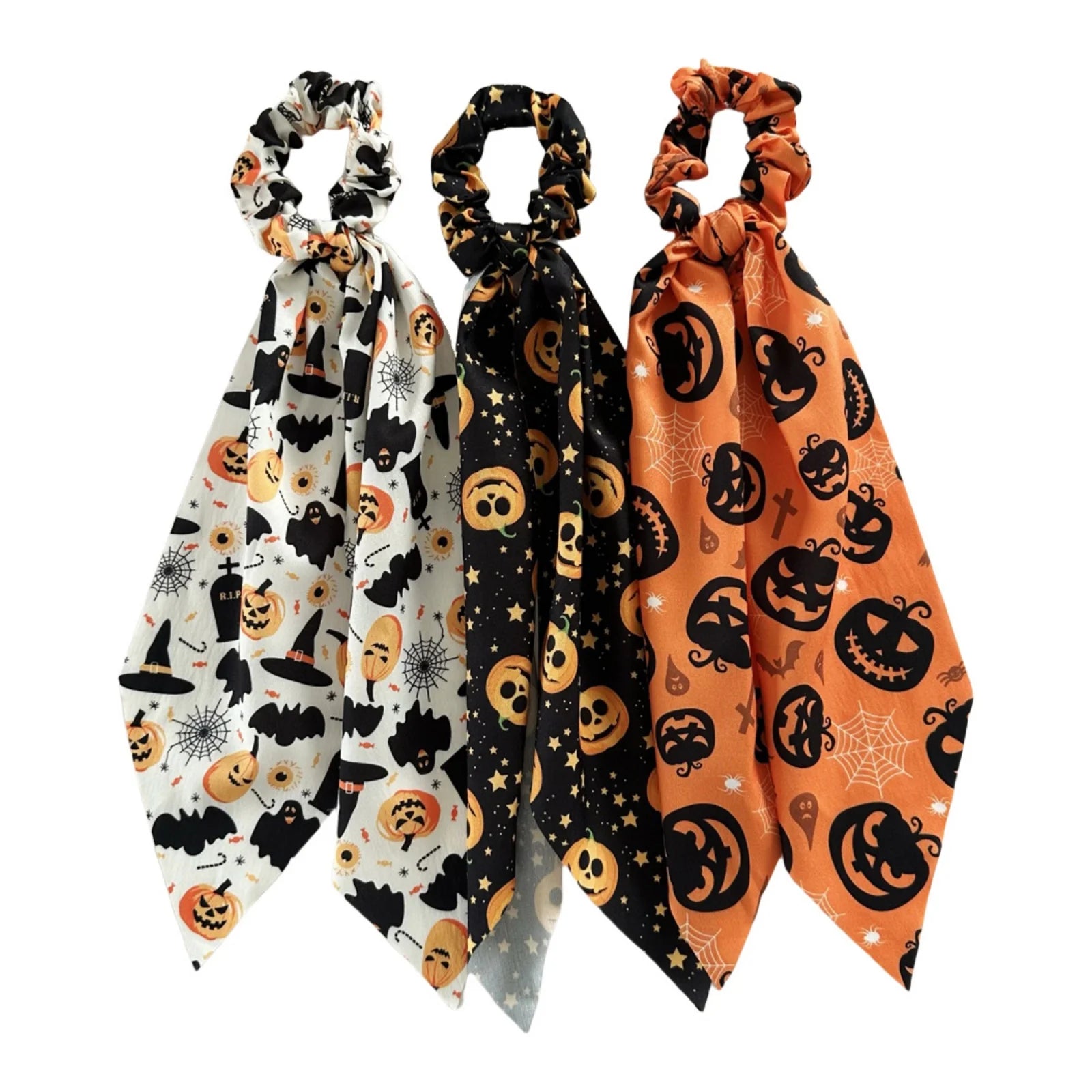 Halloween scrunchies set featuring pumpkin, bat, and skull designs in festive colors