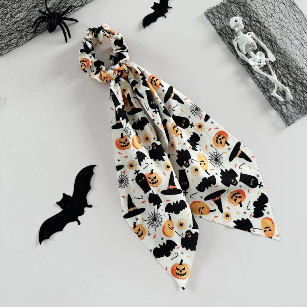 Halloween scrunchies set featuring spooky prints like pumpkins and bats for festive hairstyles