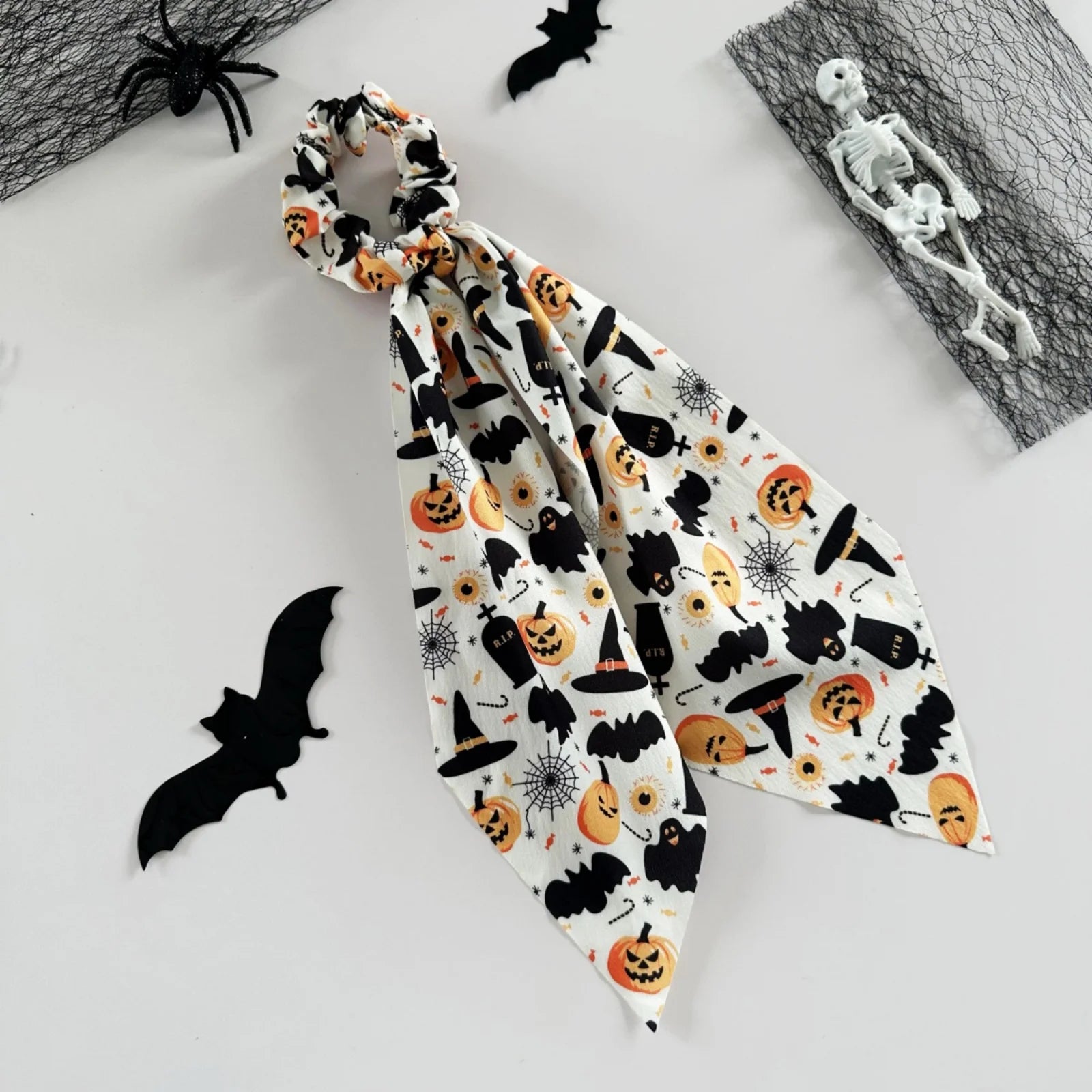Halloween scrunchies set featuring spooky prints like pumpkins and bats for festive hairstyles
