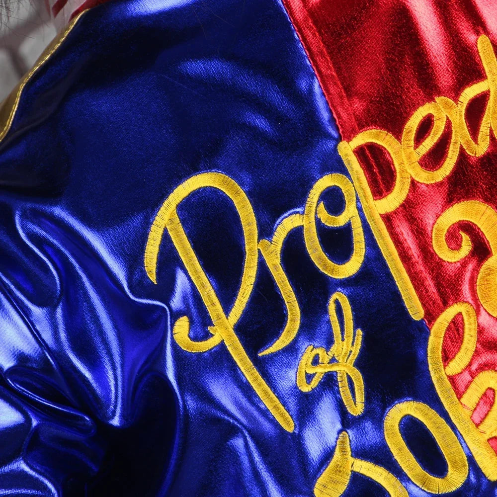 Close-up of Harley Quinn costume for adults featuring vibrant colors and detailed embroidery