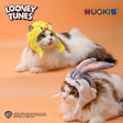 Two cats wearing Looney Tunes cat Halloween costume hats featuring Tweety Bird and Bugs Bunny designs