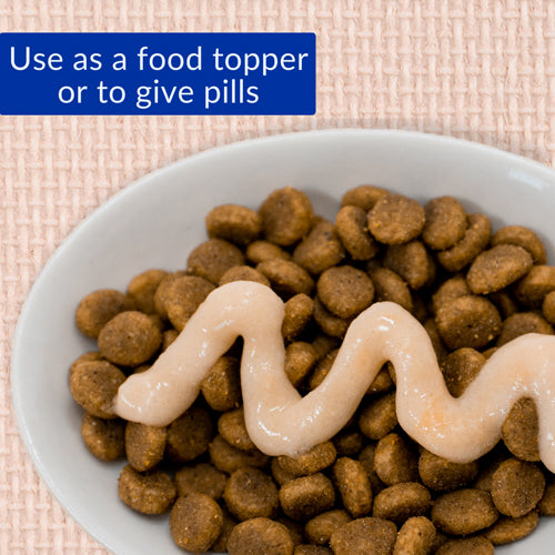 Cat treat variety pack 20 count with wet food topper on dry kibble in white bowl