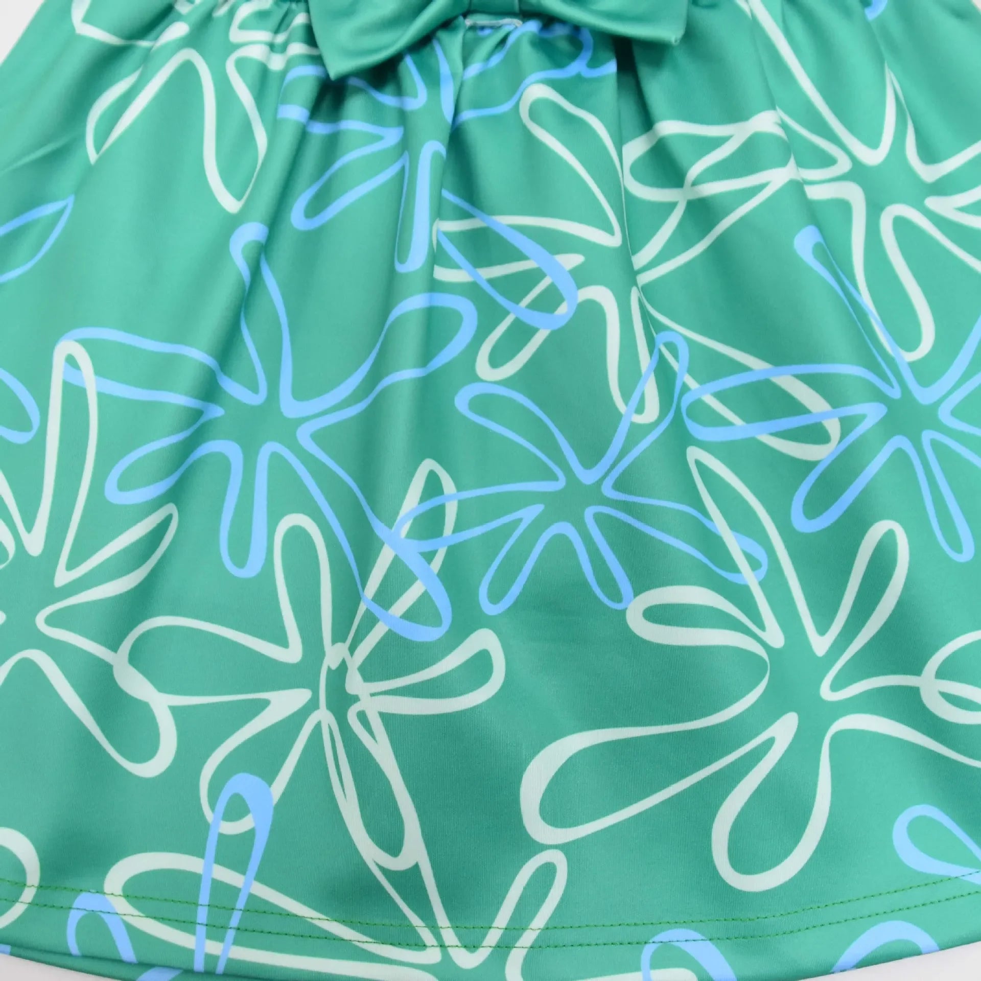 Inside Out Joy Halloween costume dress featuring a cheerful blue and green floral design