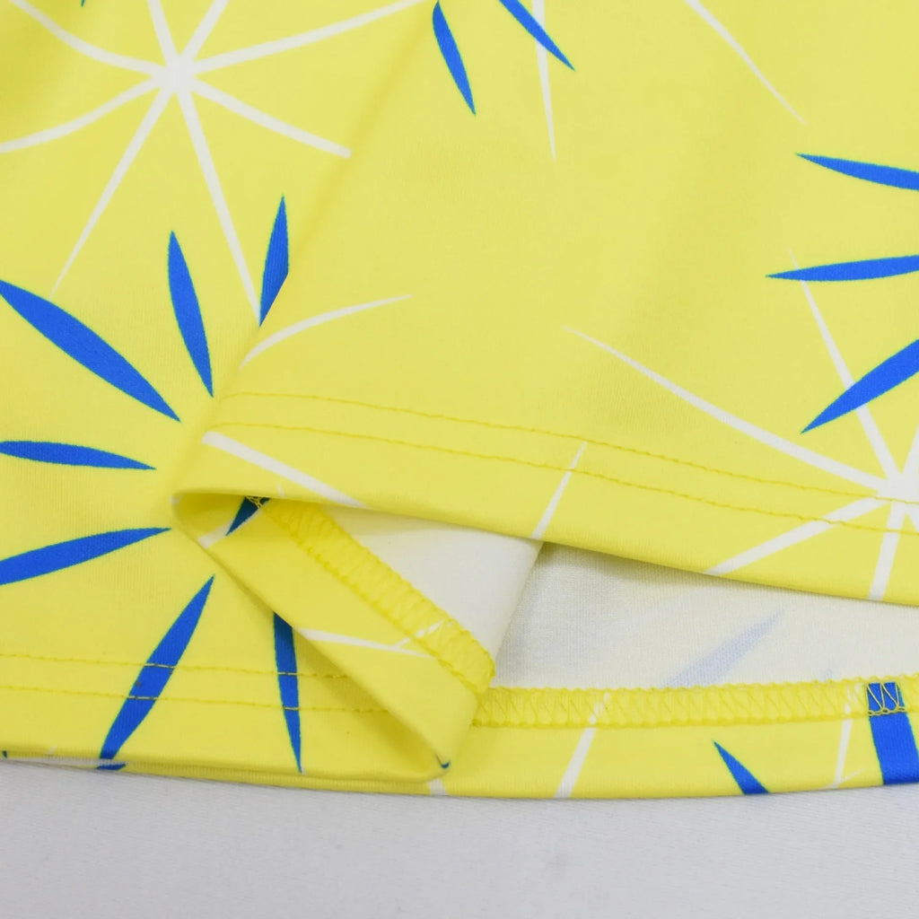 Vibrant yellow fabric with blue patterns for Inside Out Joy Halloween costume