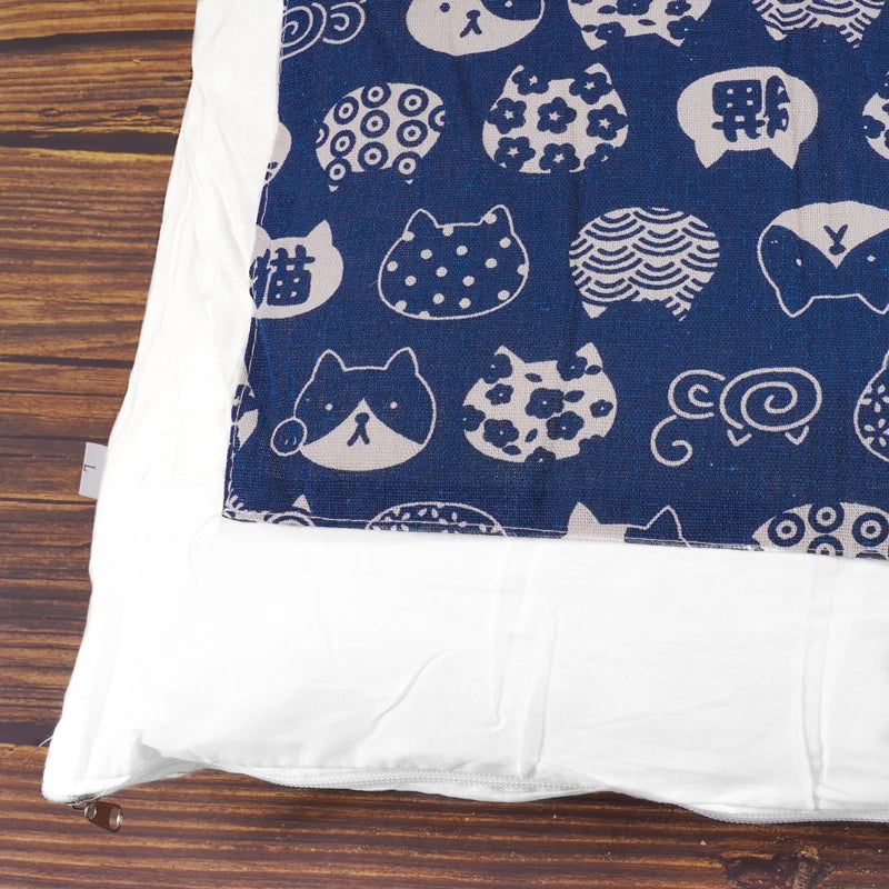 Japanese cat sleeping bag featuring cute cat patterns on a dark blue background for cozy pet comfort
