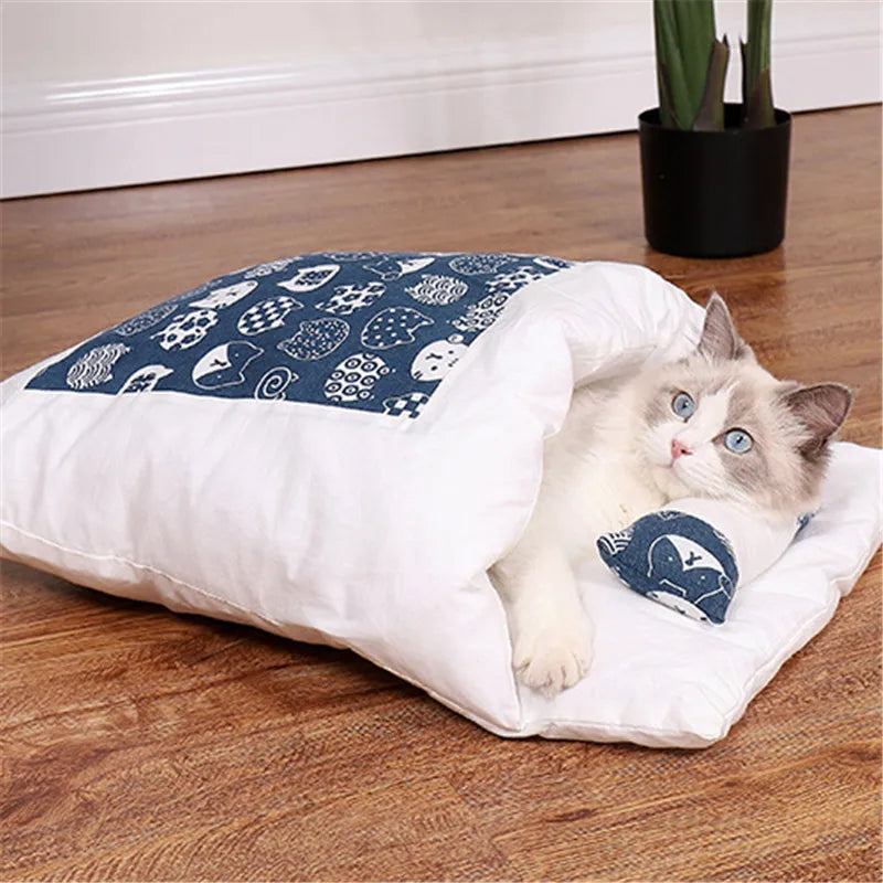 Cozy Japanese cat sleeping bag with cute fish patterns, perfect for pets to snuggle and rest