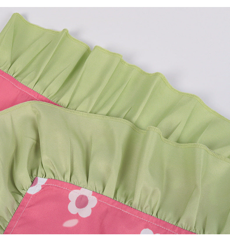 Detail of Kanroji Mitsuri cosplay costume with ruffled green and pink fabric