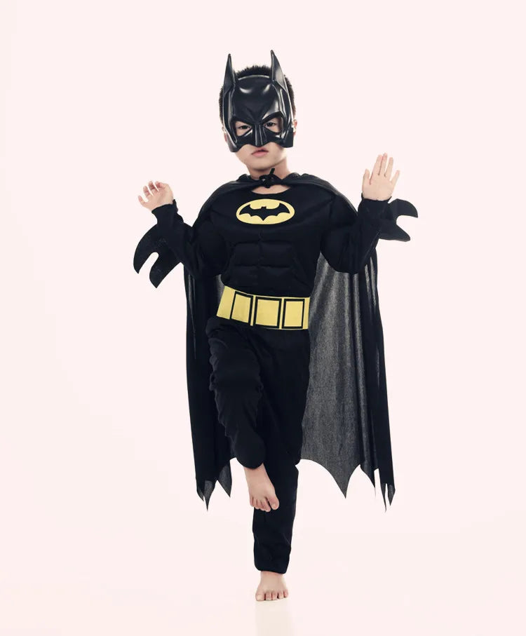 Child in a kids batman costume with cape featuring iconic mask and logo