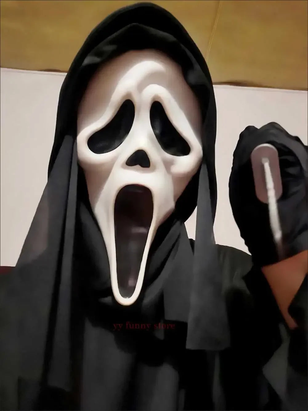 Kids scream costume Halloween 2025 featuring a black hooded cloak and ghost mask