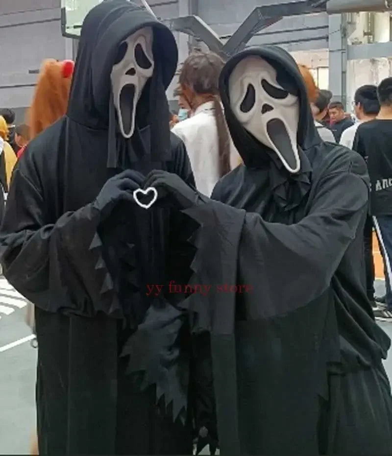 Two kids in scream costumes for Halloween 2025 making a heart shape with their hands