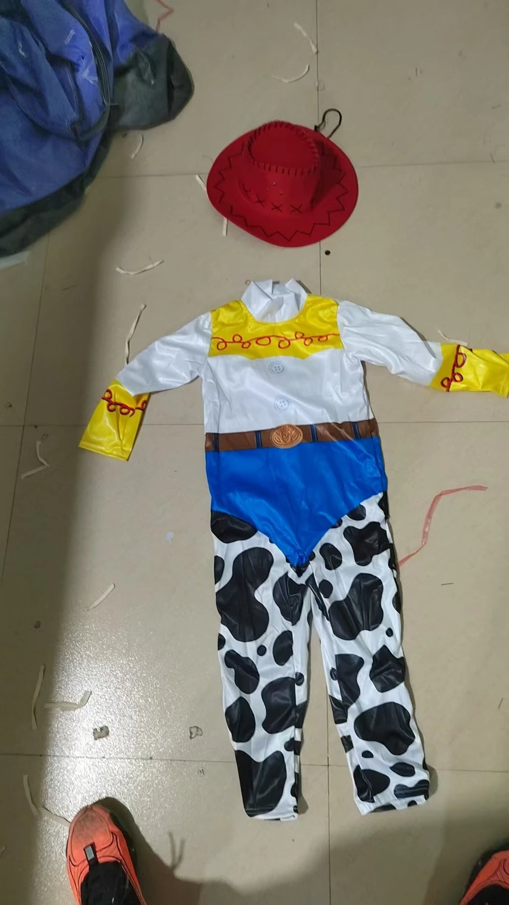 Kids Toy Story Jessie cosplay outfit with cow-print pants and red hat for imaginative play