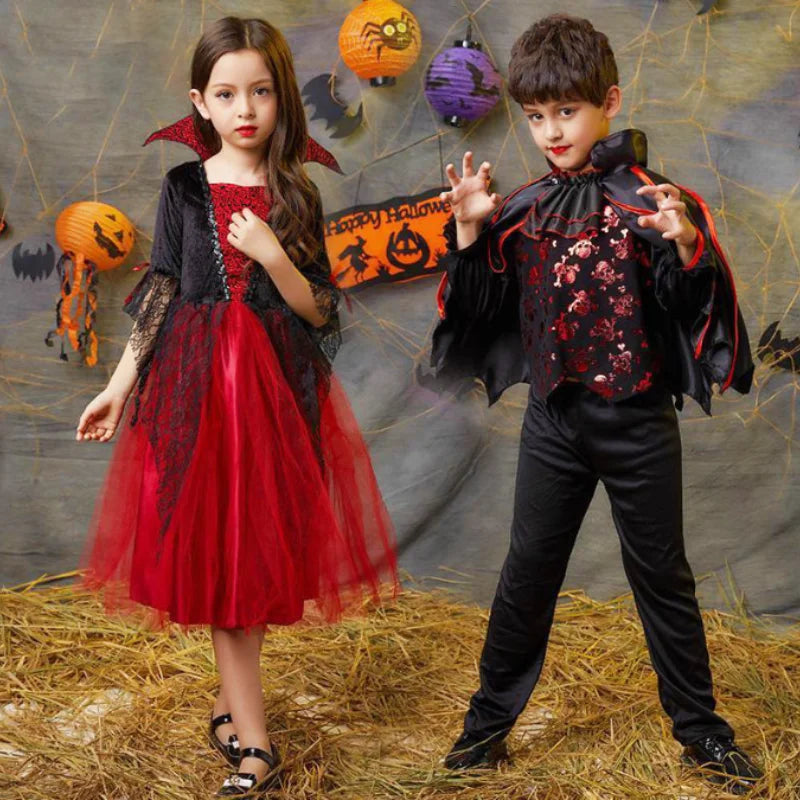 Kids vampire Halloween costume from Zoomies & Co featuring a dramatic red and black dress and cape