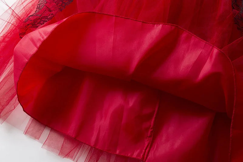 Inside view of a kids vampire Halloween costume featuring red tulle fabric and a comfortable lining