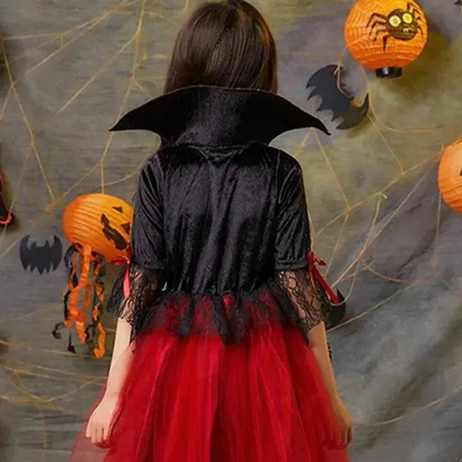 Kids vampire Halloween costume with a black cape and red tulle dress for spooky celebrations
