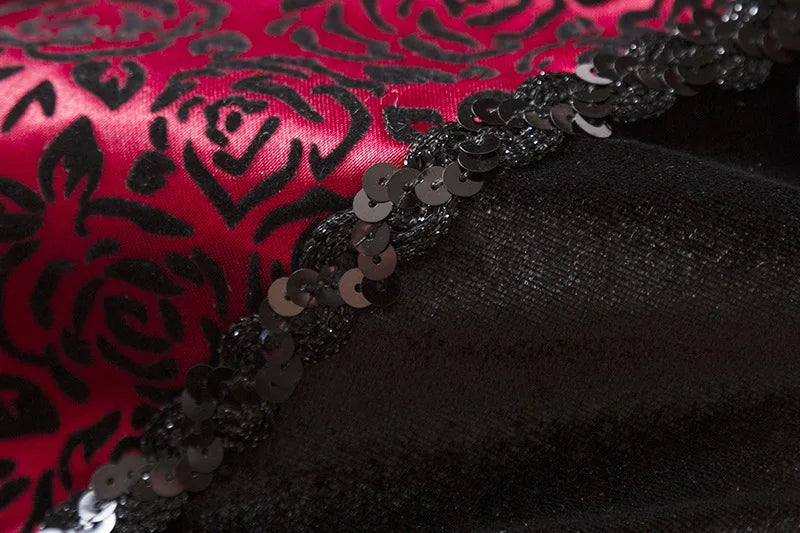 Close-up of black and red fabric with sequin trim for kids vampire Halloween costume
