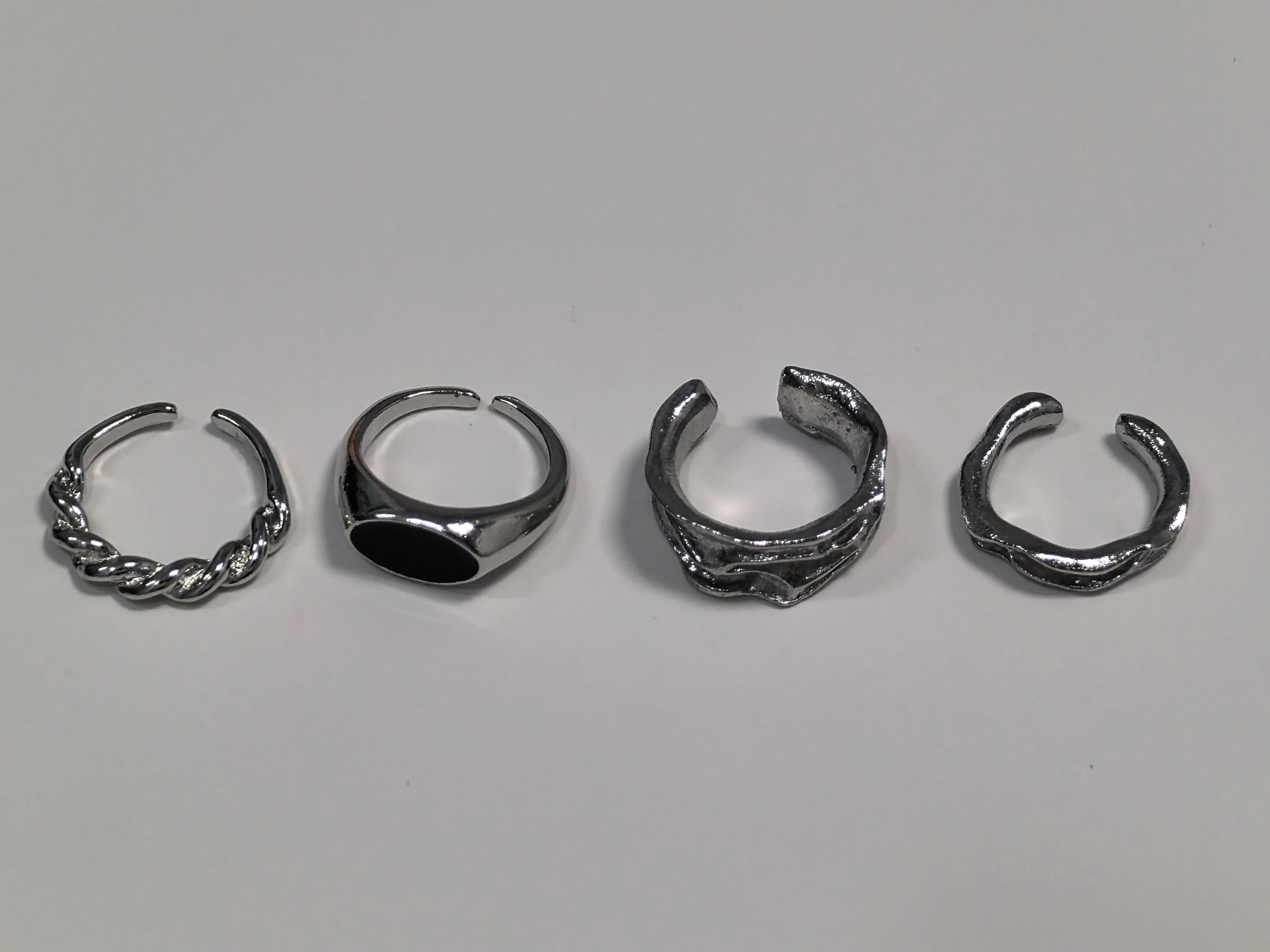 Set of four silver rings featuring unique designs for Demon Hunters Rumi cosplay clothes for carnival