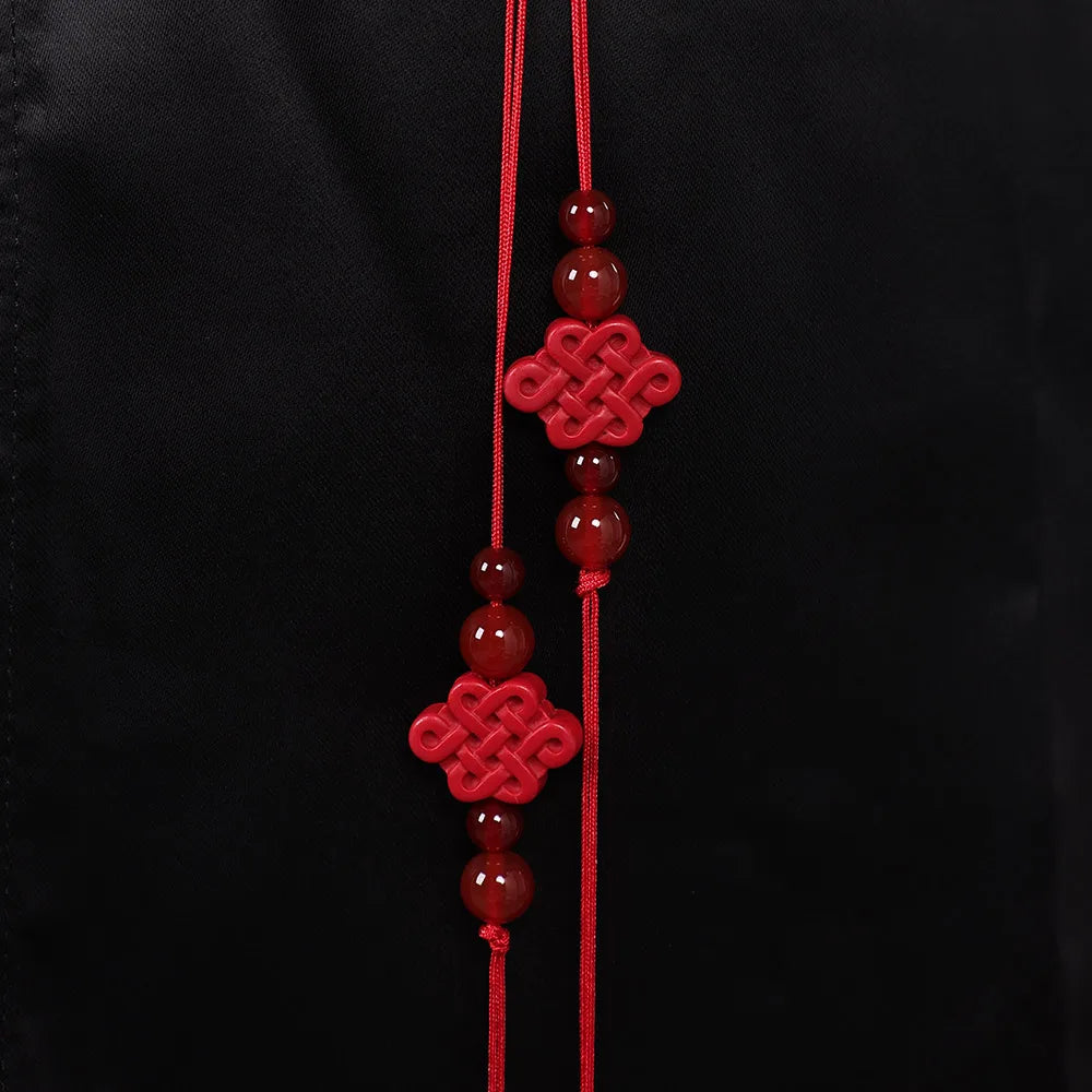 Detailed close-up of the red accents on Kpop Jinu cosplay outfit for kids with decorative beads