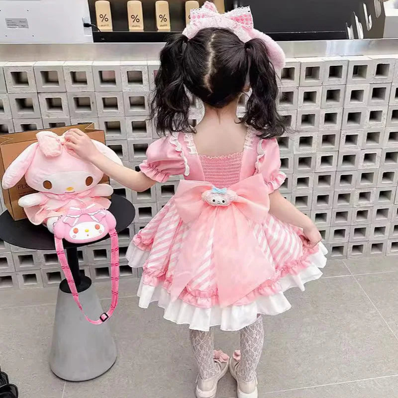 Cute girl wearing a pink Kuromi princess dress for kids with matching accessories and a hair bow