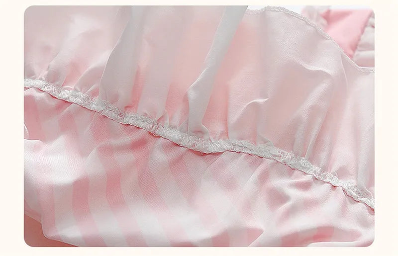 Close-up of the fabric detailing on a Kuromi princess dress for kids with pink and white stripes