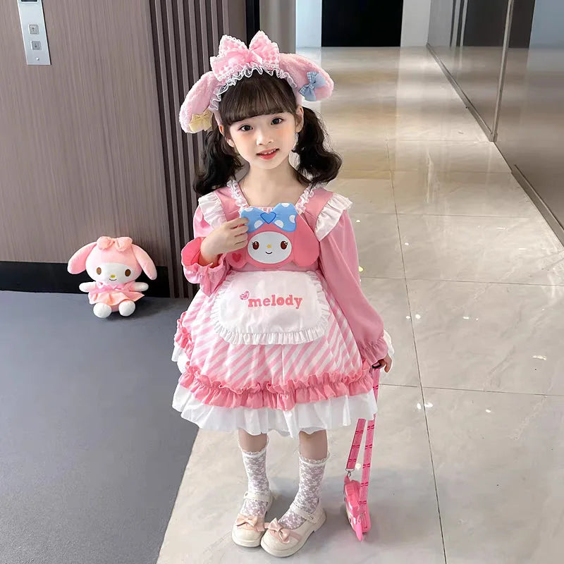 Cute girl wearing a Kuromi princess dress for kids with pink and white stripes and a character design