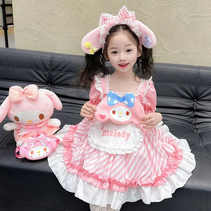 Adorable girl wearing a pink Kuromi princess dress for kids with a matching headpiece and plush toys
