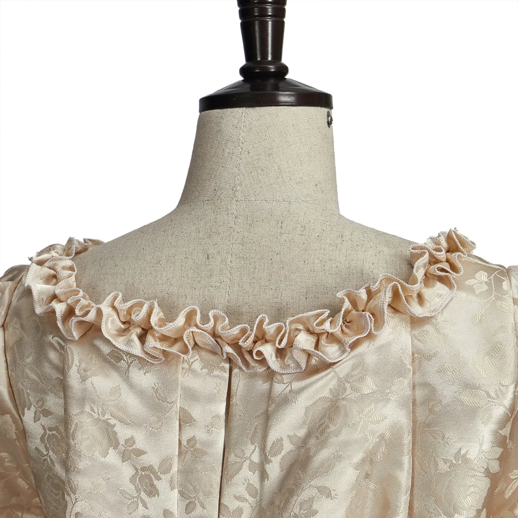 Elegant 18th century Georgian costume featuring ruffled neckline detail and intricate fabric texture