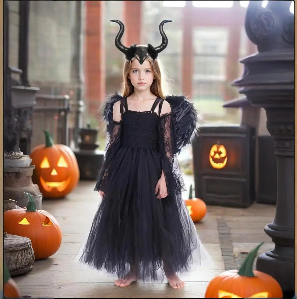 Girl wearing a Maleficent Halloween costume for girls with black dress and horned headpiece