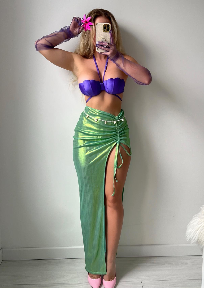 Stylish mermaid costume for women with purple top, green skirt, and matching accessories