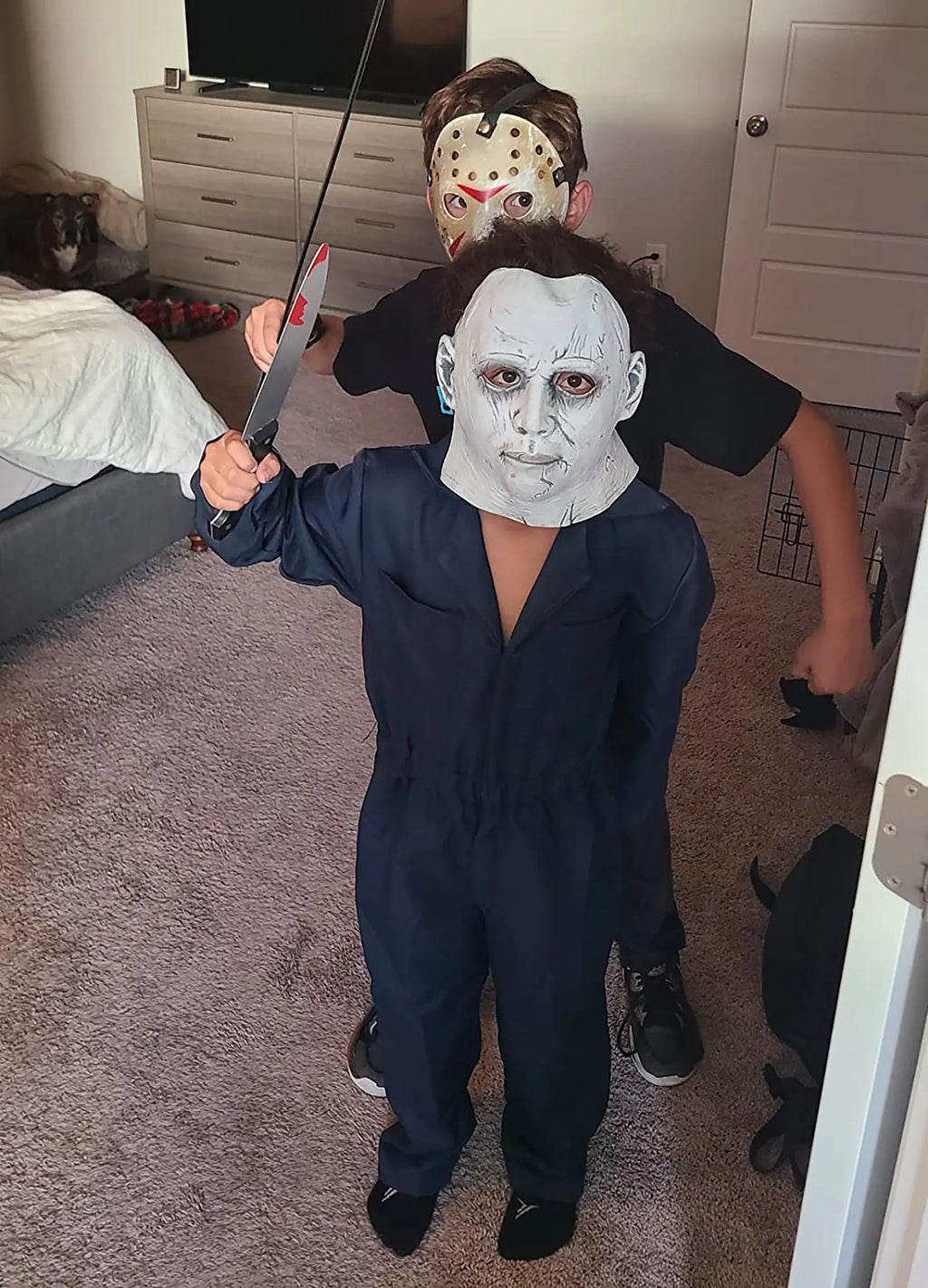 Michael Myers kids costume featuring a mask and blue jumpsuit for Halloween fun
