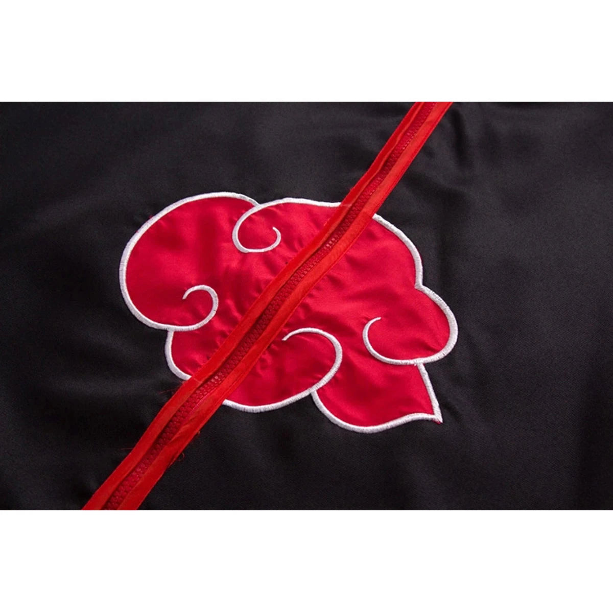 Close-up of Naruto costume for kids and adults featuring a red cloud emblem on a black fabric background