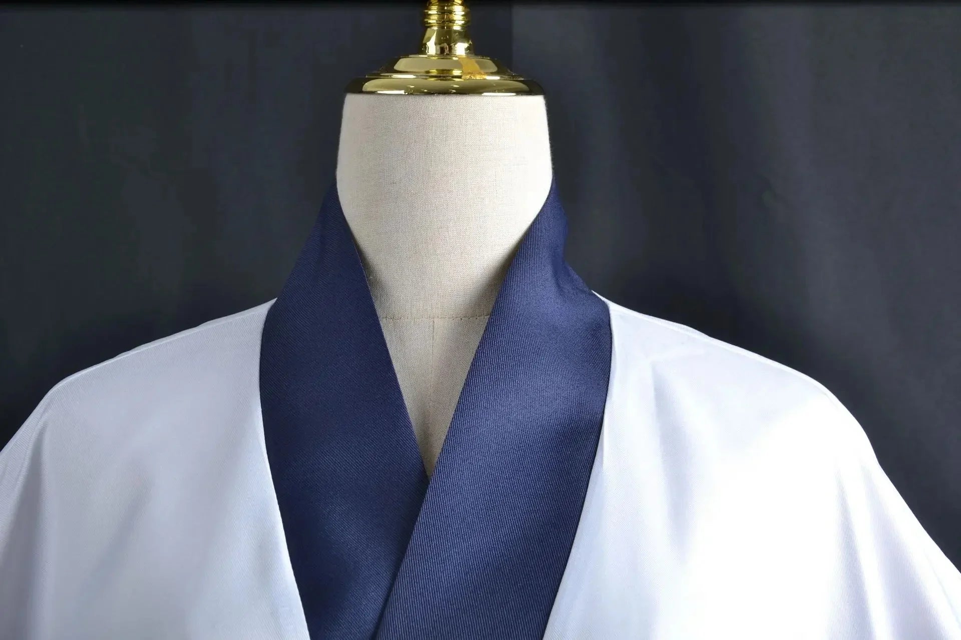 One Piece Zoro Halloween costume featuring a stylish white garment with a navy blue collar