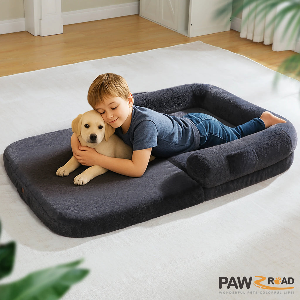 Child cuddling a puppy on a cozy foldable dog bed for comfortable pet relaxation