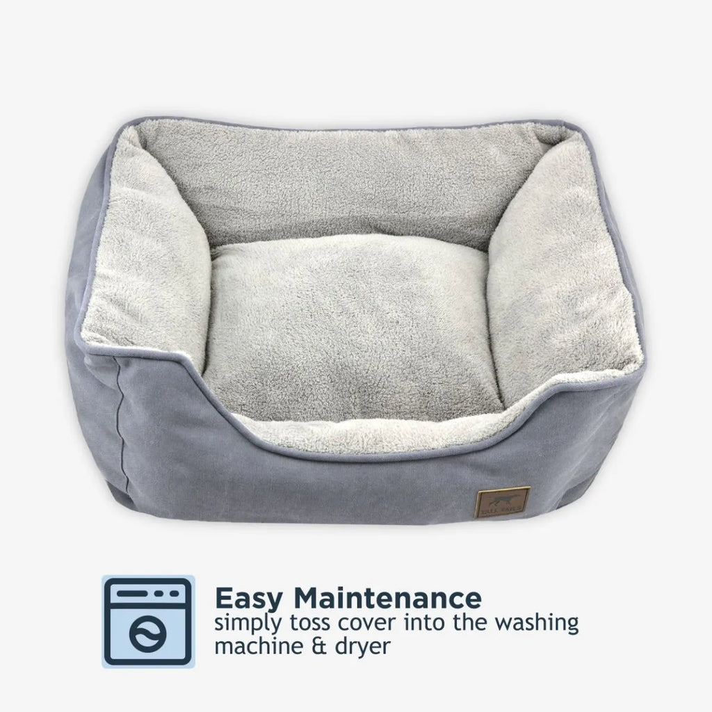 Gray plush pet bed with soft cushion and washable cover for easy maintenance