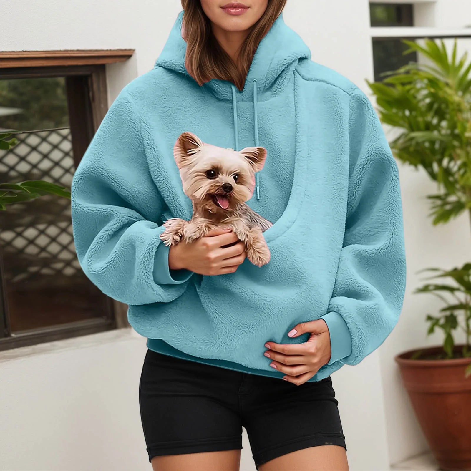 Cozy blue pet carrier hoodie with a front pouch for small dogs, perfect for pet owners on the go