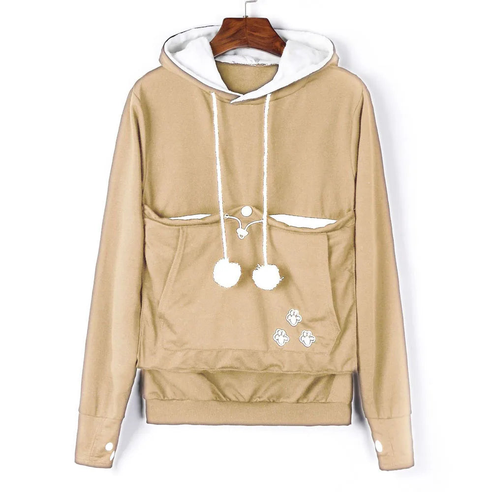 Beige pet carrier kangaroo sweatshirt with double front pockets and pom pom details for pet lovers