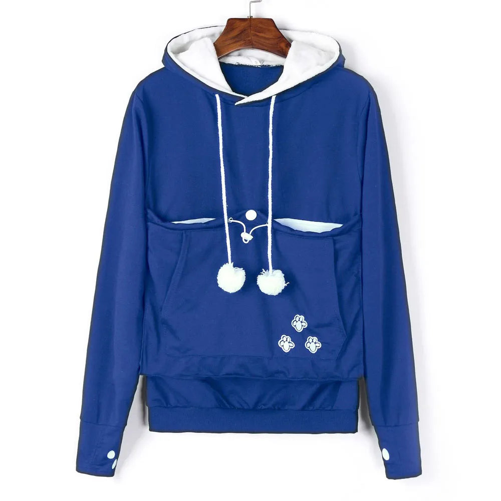 Cozy blue pet carrier kangaroo sweatshirt with front pockets and pom-pom details for pet owners